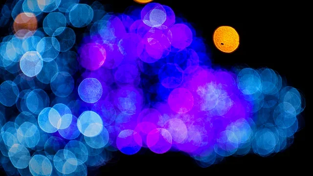 Cluster of glowing blue and violet light orbs