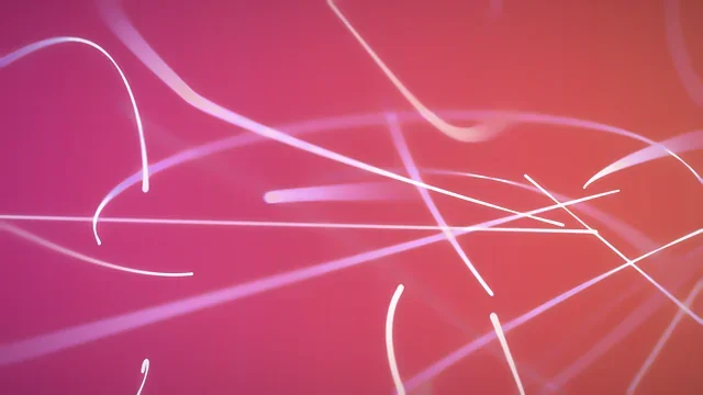 Orange and pink light swirl on a dark background