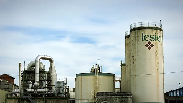 Industrial pipes and valves in a plant corridor