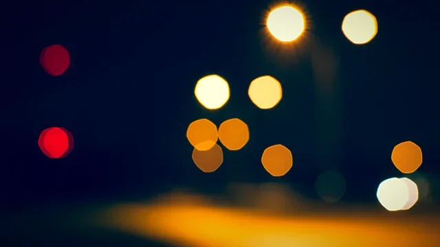 Cool blue bokeh lights in evening darkness