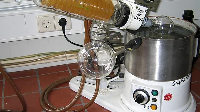 Rotary evaporator with glass condenser coil in a chemistry laboratory