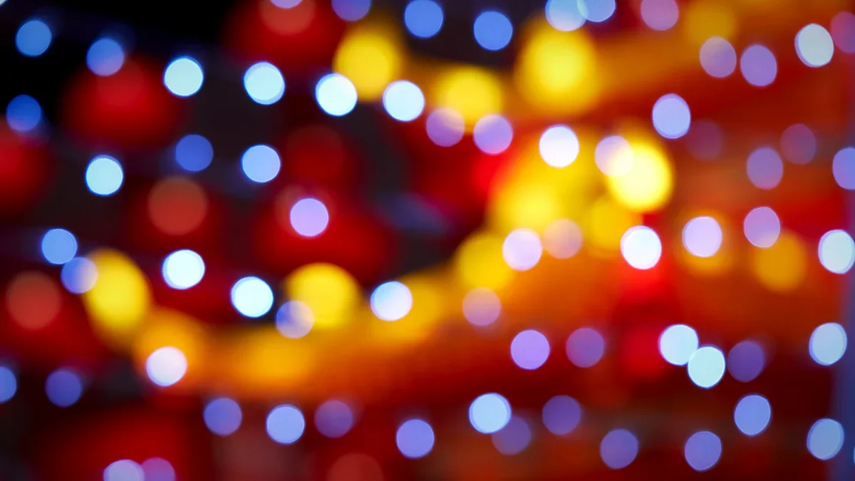 Soft multicolored bokeh orbs on a dark backdrop
