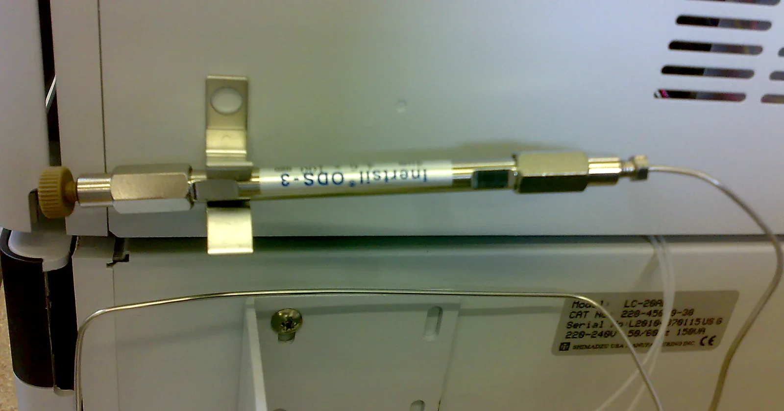 Stainless-steel HPLC column connected inside an instrument