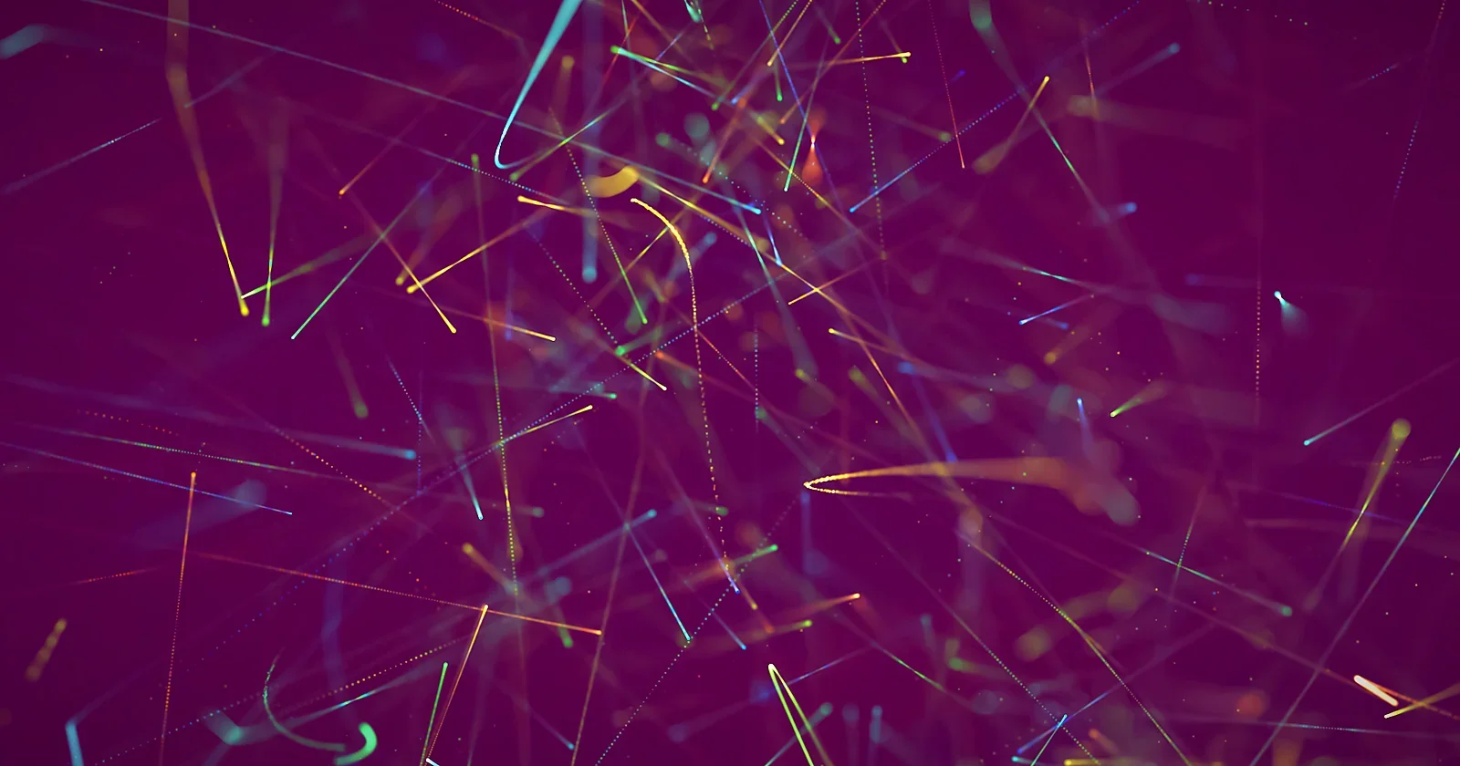 Colourful laser light lines streaming across a dark background