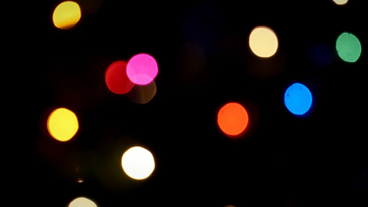 Bright multicoloured light orbs floating in darkness