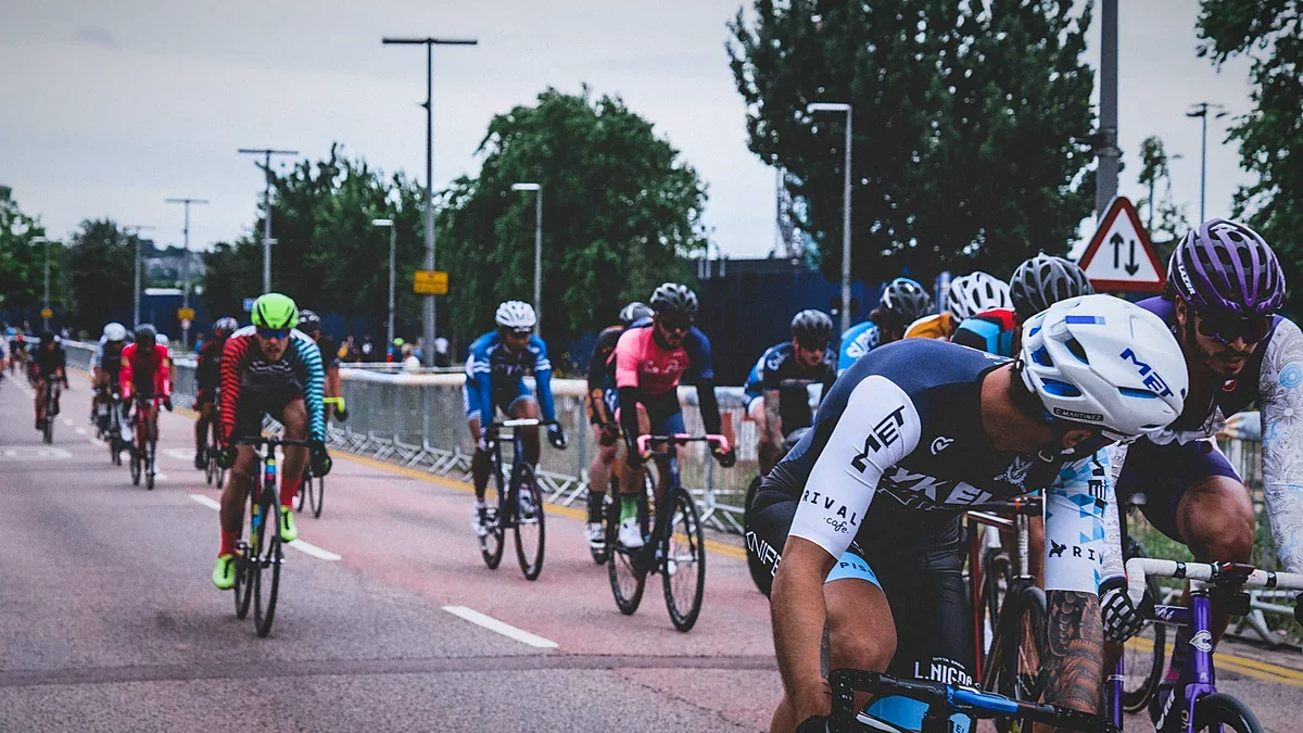 Road cyclists racing together in a tight pack