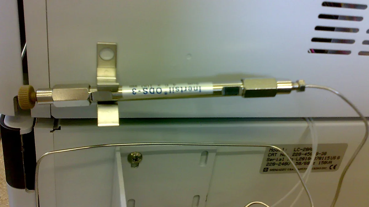 Stainless-steel HPLC column connected inside an instrument