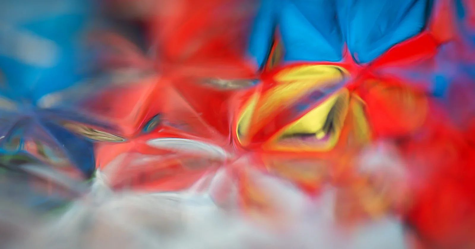 Deep blue abstract waves glowing against a dark field