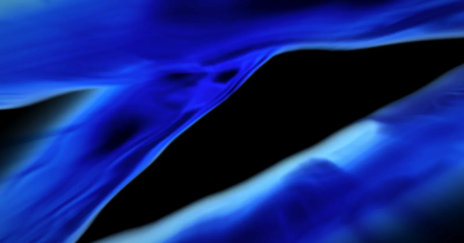 Blue light streaks racing across a dark background