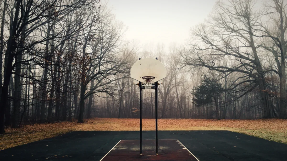 Empty outdoor basketball pitch under open sky
