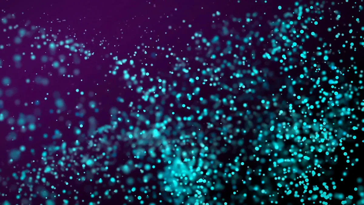 Scattered teal light particles drifting across a deep purple field