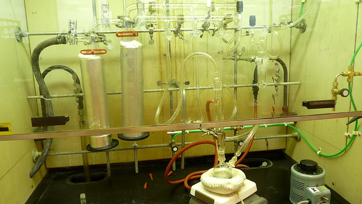 Glass vacuum manifold and flasks in a chemistry fume hood
