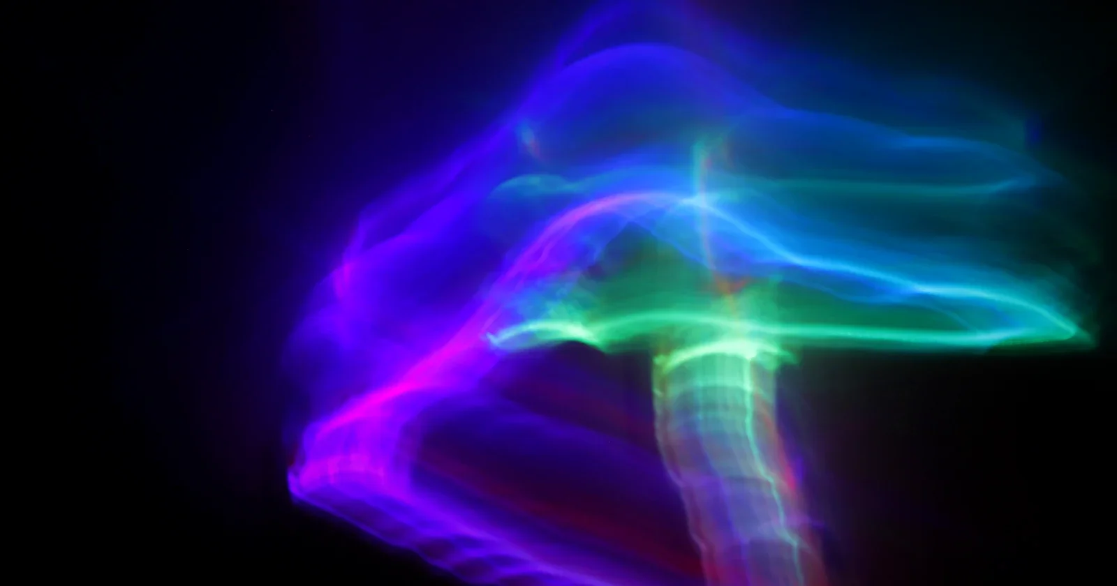 Glowing violet and teal light form rising from a dark base, evoking a receptor at a cell surface