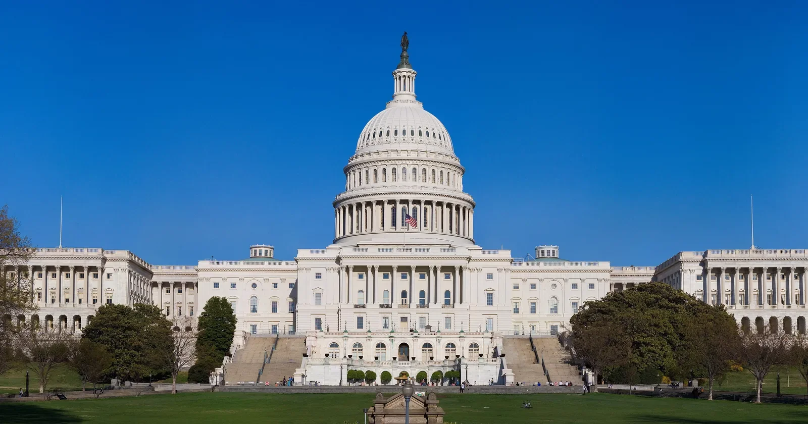 West front of the United States Capitol under a clear blue sky in Washington
