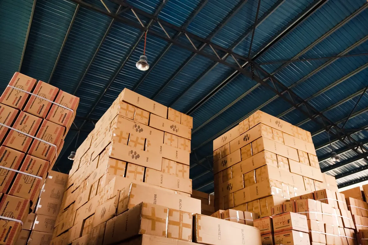 Stacks of shipping cartons in a warehouse